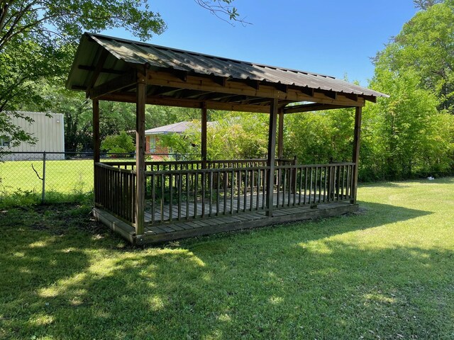 exterior space featuring a gazebo and fence