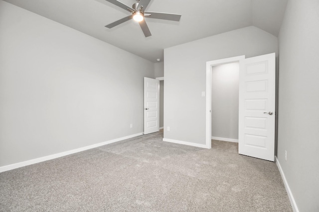 unfurnished bedroom featuring carpet flooring, a ceiling fan, and baseboards