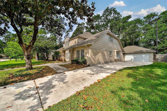 14211 Lakewood Forest Dr, Houston, TX 77070 - view of front of house with concrete driveway, brick siding, a front yard, and a garage