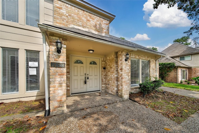 14211 Lakewood Forest Dr, Houston, TX 77070 - doorway to property featuring brick siding
