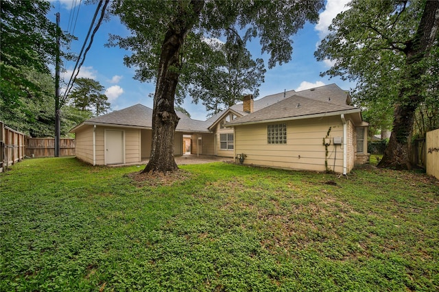 14211 Lakewood Forest Dr, Houston, TX 77070 - rear view of house featuring a lawn, a fenced backyard, and a patio