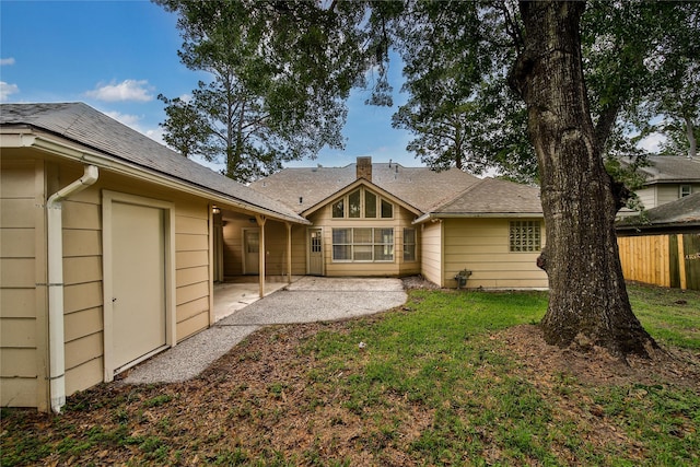14211 Lakewood Forest Dr, Houston, TX 77070 - rear view of house with a lawn, roof with shingles, fence, and a patio area
