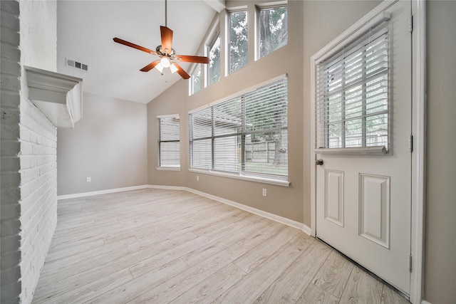 14211 Lakewood Forest Dr, Houston, TX 77070 - unfurnished living room featuring visible vents, baseboards, ceiling fan, high vaulted ceiling, and light wood finished floors