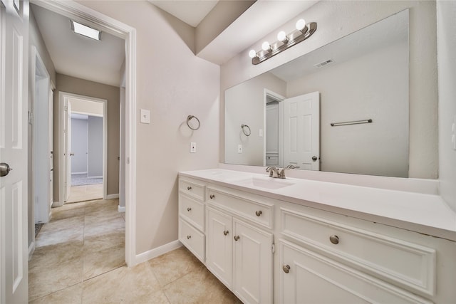 14211 Lakewood Forest Dr, Houston, TX 77070 - bathroom featuring baseboards, visible vents, tile patterned flooring, and vanity