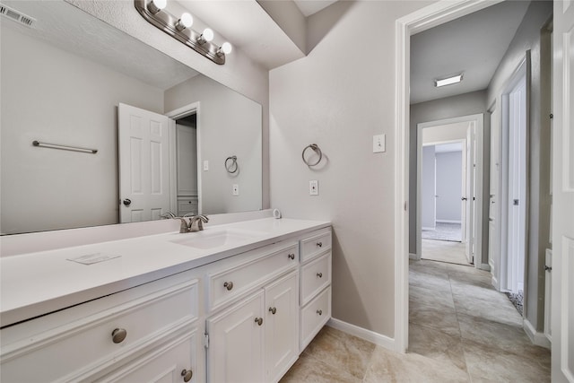 14211 Lakewood Forest Dr, Houston, TX 77070 - bathroom with vanity, baseboards, tile patterned flooring, and visible vents