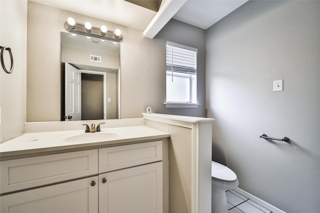 14211 Lakewood Forest Dr, Houston, TX 77070 - half bath featuring visible vents, tile patterned floors, baseboards, vanity, and toilet