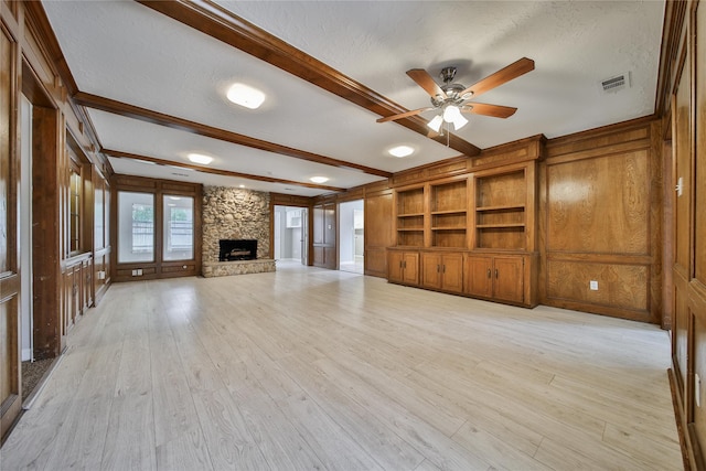 14211 Lakewood Forest Dr, Houston, TX 77070 - unfurnished living room featuring ceiling fan, a textured ceiling, visible vents, and beam ceiling