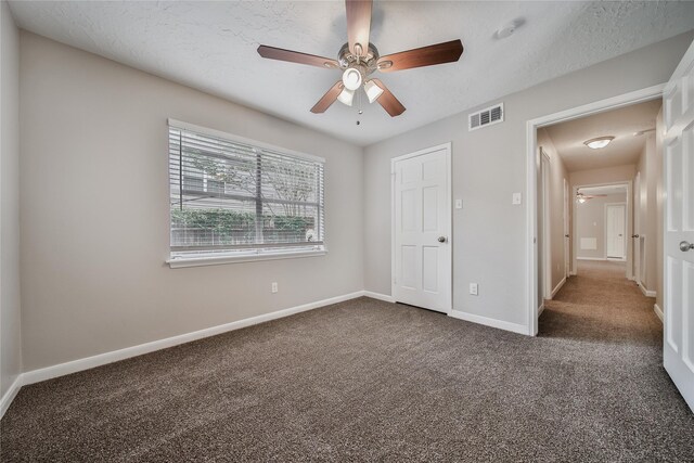 14211 Lakewood Forest Dr, Houston, TX 77070 - unfurnished bedroom featuring a ceiling fan, a textured ceiling, visible vents, baseboards, and carpet flooring
