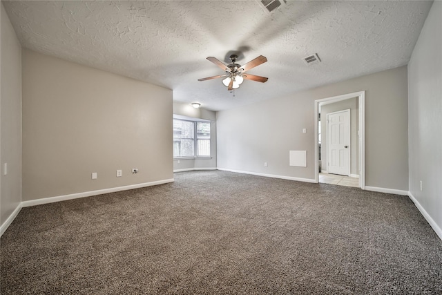 14211 Lakewood Forest Dr, Houston, TX 77070 - carpeted empty room with a textured ceiling, ceiling fan, visible vents, and baseboards