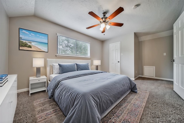 14211 Lakewood Forest Dr, Houston, TX 77070 - bedroom with lofted ceiling, baseboards, a textured ceiling, a ceiling fan, and carpet