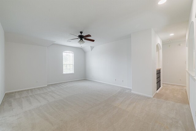 spare room featuring a ceiling fan, baseboards, light colored carpet, and recessed lighting