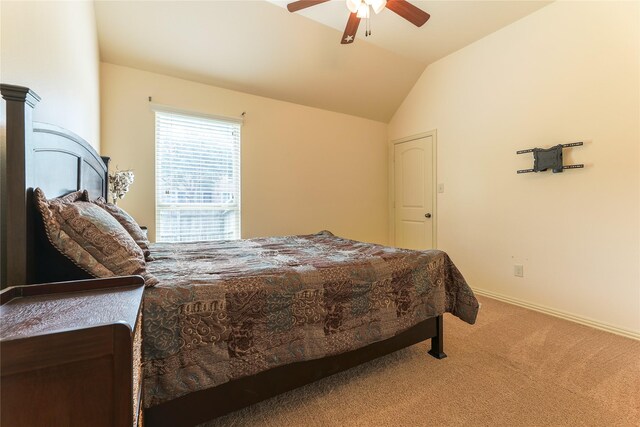 bedroom featuring carpet floors, baseboards, vaulted ceiling, and ceiling fan