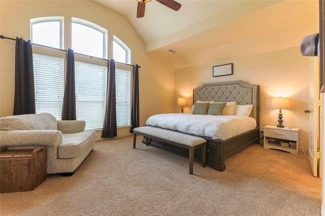 bedroom with ceiling fan, lofted ceiling, and light carpet