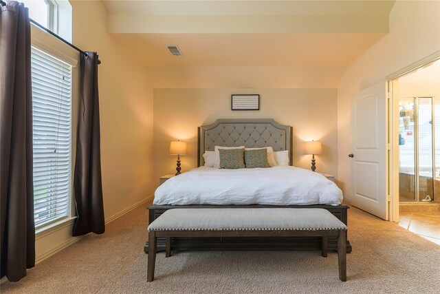 bedroom with baseboards, multiple windows, carpet flooring, and visible vents