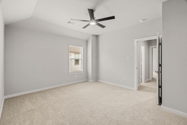empty room with visible vents, baseboards, ceiling fan, and light carpet
