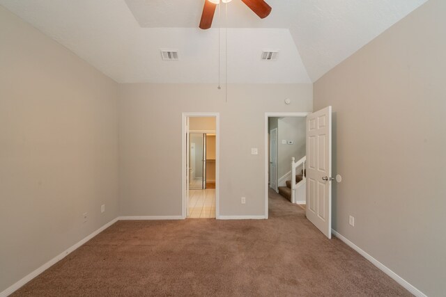 unfurnished bedroom with baseboards, a ceiling fan, carpet flooring, and visible vents
