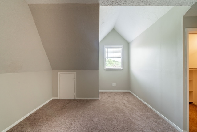 18927 Sandia Pines Dr, Humble, TX 77346 - bonus room featuring carpet flooring, lofted ceiling, and baseboards