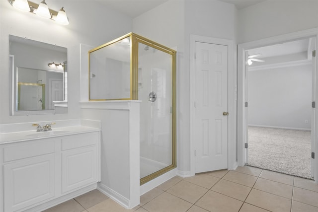 2126 Fortuna Bella Dr, Pearland, TX 77581 - bathroom with vanity, tile patterned flooring, baseboards, and a stall shower