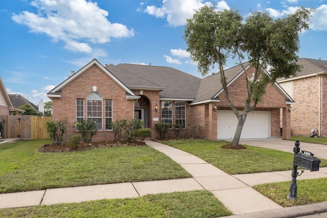 2126 Fortuna Bella Dr, Pearland, TX 77581 - ranch-style house featuring a garage, a front lawn, fence, brick siding, and concrete driveway