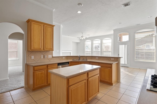 2126 Fortuna Bella Dr, Pearland, TX 77581 - kitchen featuring ceiling fan, visible vents, stainless steel dishwasher, a sink, and a peninsula