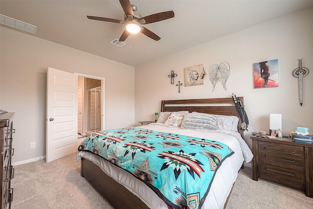 bedroom with light colored carpet, a ceiling fan, visible vents, and baseboards