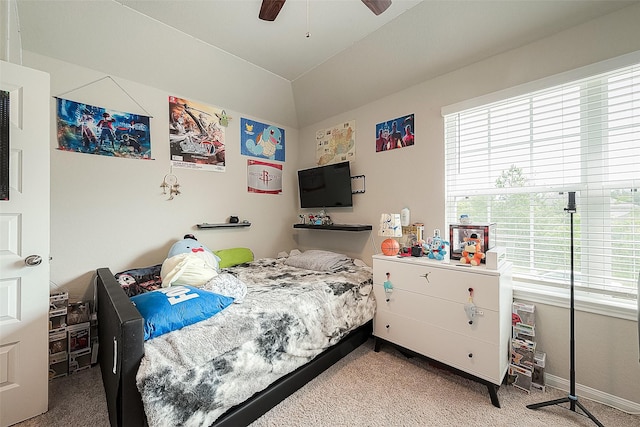 bedroom featuring baseboards, multiple windows, carpet, and lofted ceiling