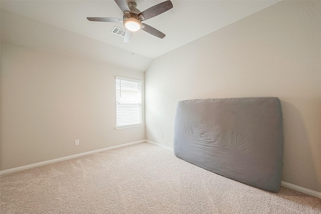 unfurnished room featuring baseboards, a ceiling fan, light colored carpet, and lofted ceiling