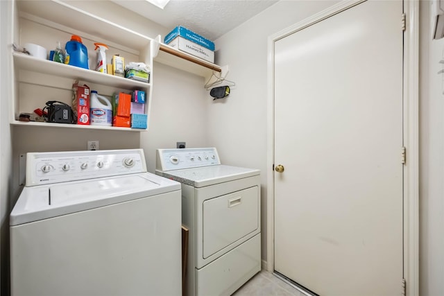 laundry room featuring separate washer and dryer and laundry area