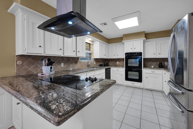 kitchen featuring white cabinets, a peninsula, island exhaust hood, and black appliances
