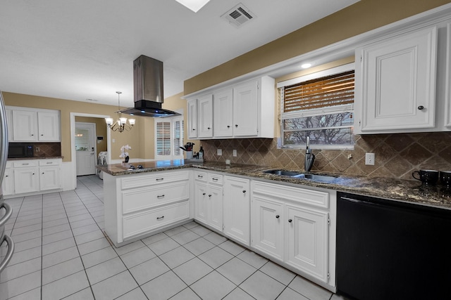 kitchen featuring a sink, a chandelier, a peninsula, island range hood, and black appliances