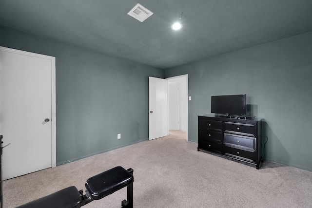 workout room with carpet flooring and visible vents