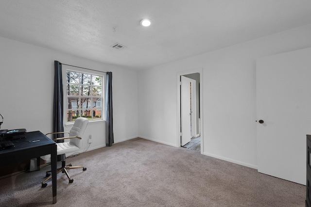 office space featuring visible vents, baseboards, and carpet floors