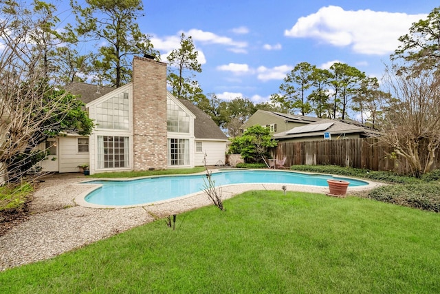 view of pool with a lawn, a fenced backyard, and a fenced in pool