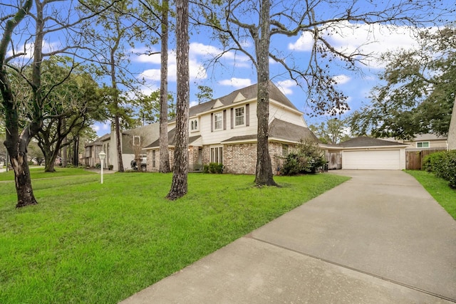11827 Normont Dr, Houston, TX 77070 - view of front of home featuring driveway, a front yard, and brick siding
