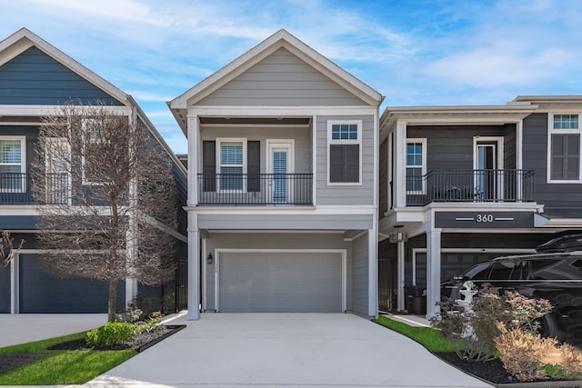 358 W 26th St, Houston, TX 77008 - townhome / multi-family property featuring an attached garage, driveway, and a balcony