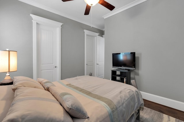 358 W 26th St, Houston, TX 77008 - bedroom featuring baseboards, ornamental molding, a ceiling fan, and wood finished floors
