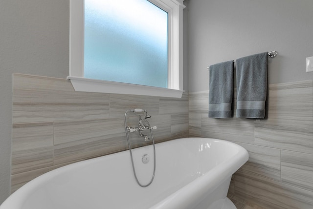 358 W 26th St, Houston, TX 77008 - full bath featuring tile walls and a freestanding bath