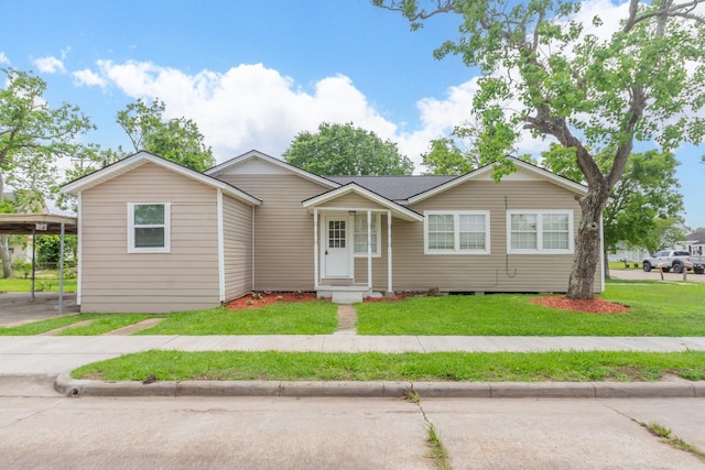 ranch-style house with a front lawn and a carport