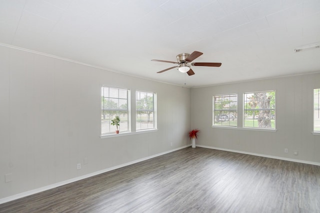 unfurnished room with a healthy amount of sunlight and wood finished floors
