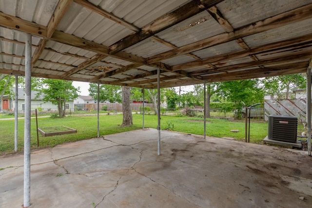 view of patio with central AC, a fenced backyard, and a carport