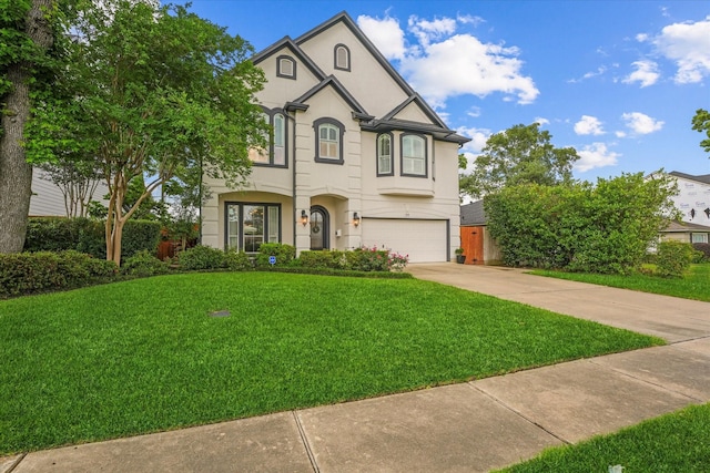919 Worthshire St, Houston, TX 77008 - view of front of home with a garage, stucco siding, driveway, and a front lawn