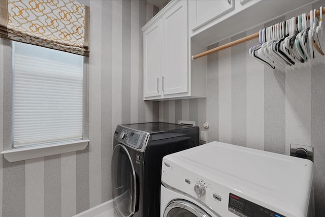 919 Worthshire St, Houston, TX 77008 - laundry room featuring cabinet space, wallpapered walls, and independent washer and dryer