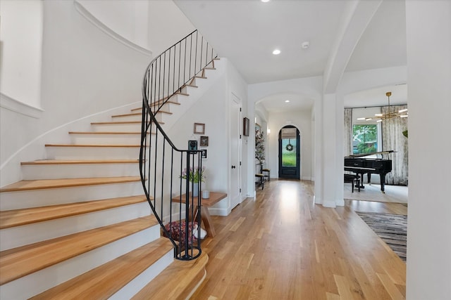 919 Worthshire St, Houston, TX 77008 - entrance foyer featuring arched walkways, wood finished floors, stairs, baseboards, and recessed lighting