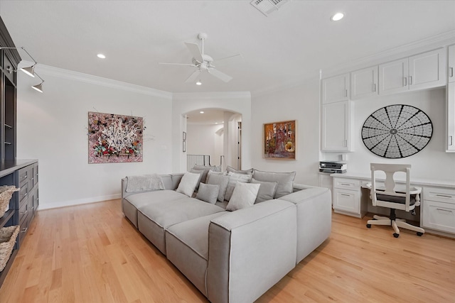 919 Worthshire St, Houston, TX 77008 - living area featuring arched walkways, a ceiling fan, recessed lighting, light wood-type flooring, and ornamental molding