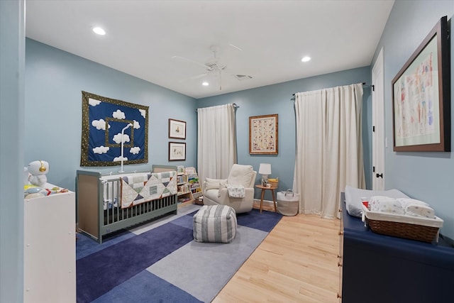 919 Worthshire St, Houston, TX 77008 - bedroom with wood finished floors, recessed lighting, a crib, and ceiling fan