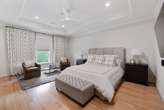 919 Worthshire St, Houston, TX 77008 - bedroom featuring a raised ceiling, crown molding, light wood finished floors, baseboards, and recessed lighting