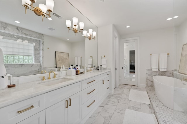 919 Worthshire St, Houston, TX 77008 - full bathroom with a chandelier, recessed lighting, marble look tile flooring, a marble finish shower, and a soaking tub