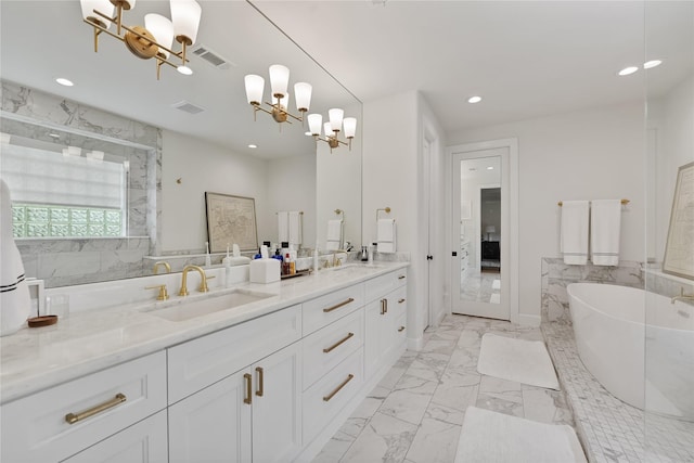 919 Worthshire St, Houston, TX 77008 - bathroom with a chandelier, recessed lighting, marble finish flooring, a freestanding bath, and a shower with door