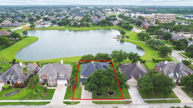 aerial view featuring a residential view and a water view