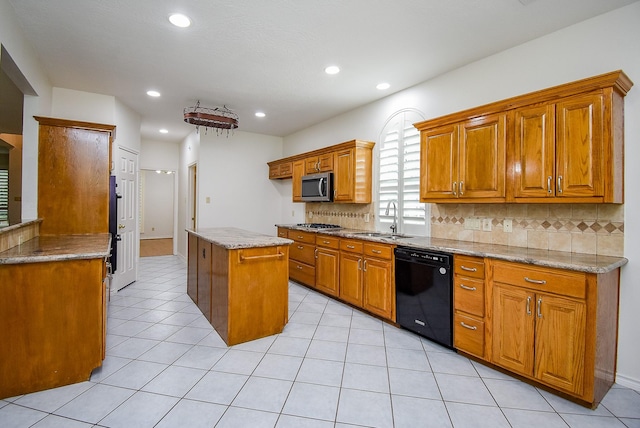 6007 Gideon Ct, Sugar Land, TX 77479 - kitchen featuring tasteful backsplash, brown cabinets, a sink, stainless steel appliances, and recessed lighting